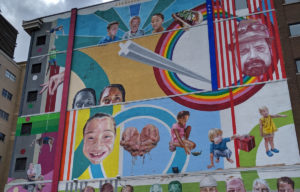 Colorful mural on side of building.
